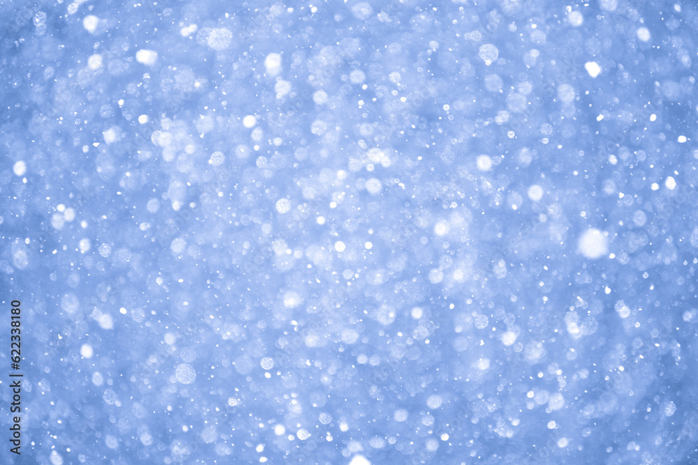 Abstract Blue Christmas Background with Real Snow. Blurred Snowflakes Photo. Abstract Blue Christmas Background with Real Snow. Blurred Snowflakes Photo.