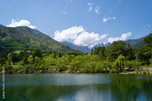 A quiet pond in Komagane City and the snowy Central Alps © Takayan