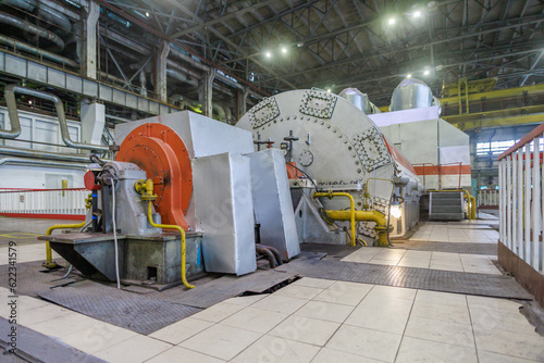 Closeup view of steam turbine and power generator. photo