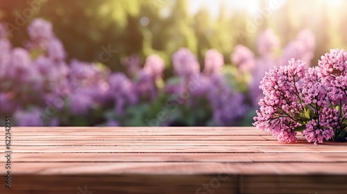 Empty wooden table top with blurred background of lavender flowers garden