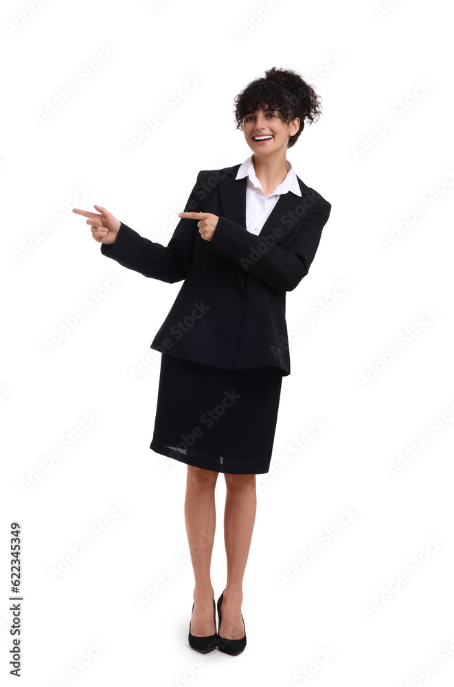 Beautiful happy businesswoman pointing at something on white background Beautiful happy businesswoman pointing at something on white background