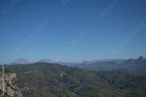 Beautiful views of the mountain nature. Mountains, forests, blue sky. The beauty of nature .