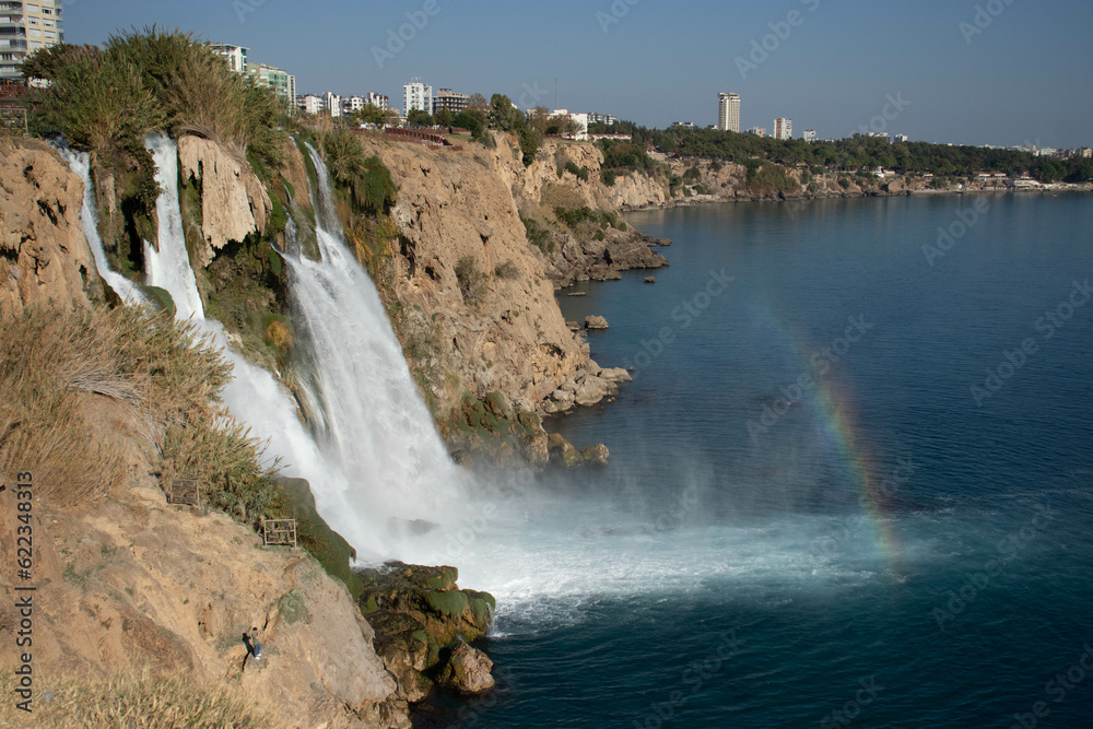 Beautiful view of the waterfall that flows into the sea. Beautiful view of the waterfall that flows into the sea.