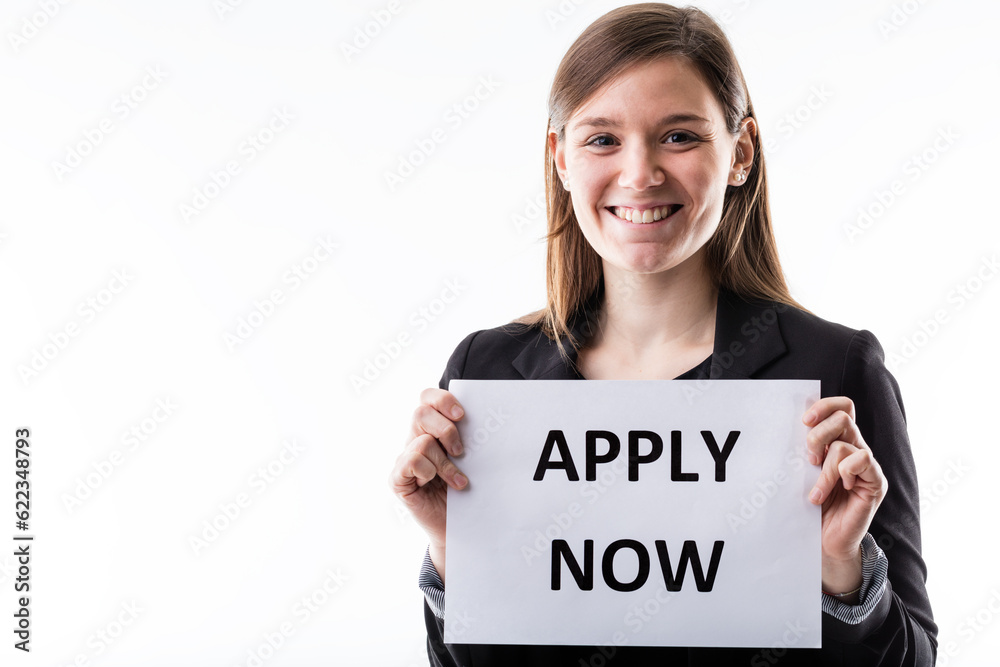 young business smiling woman or office worker holding an apply now sign young business smiling woman or office worker holding an apply now sign