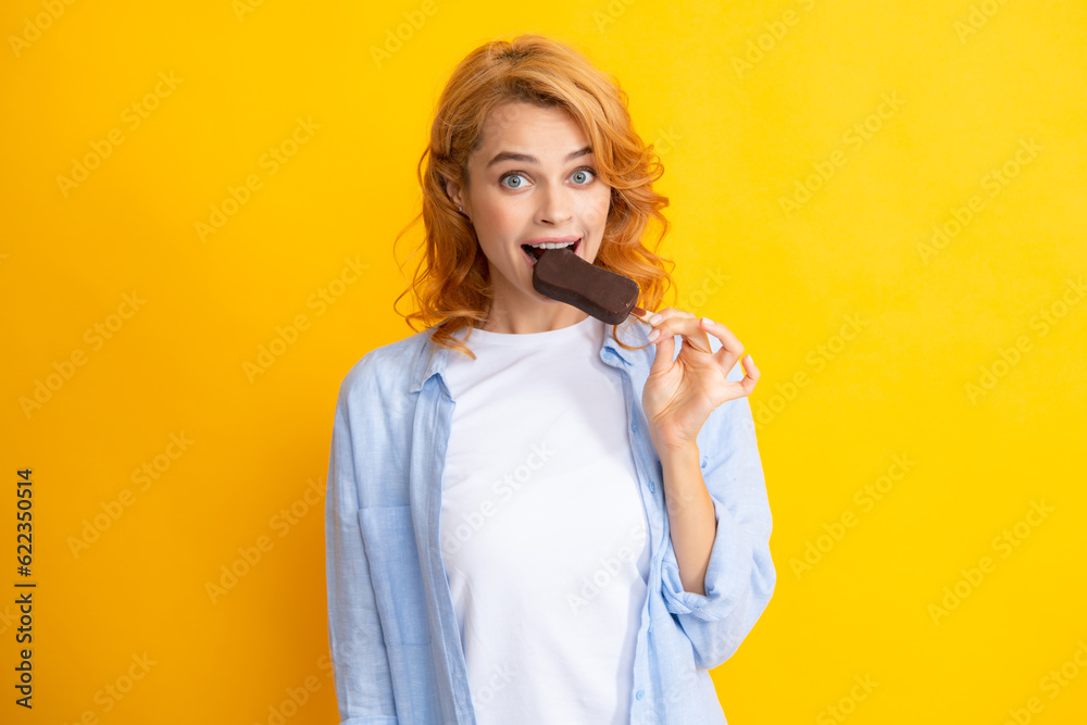 Girl posing with chocolate ice cream on yellow isolated background. Summer woman. Girl posing with chocolate ice cream on yellow isolated background. Summer woman.