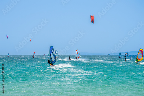 Kitesurfing on Valdevaqueros beach, Gibraltar Strait in Tarifa, Spain on June 17, 2023