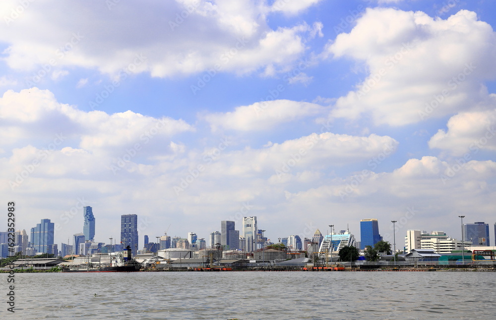 Cityscape skyline at the downtown area of BANGKOK THAILAND in cloudy day with river view in front.