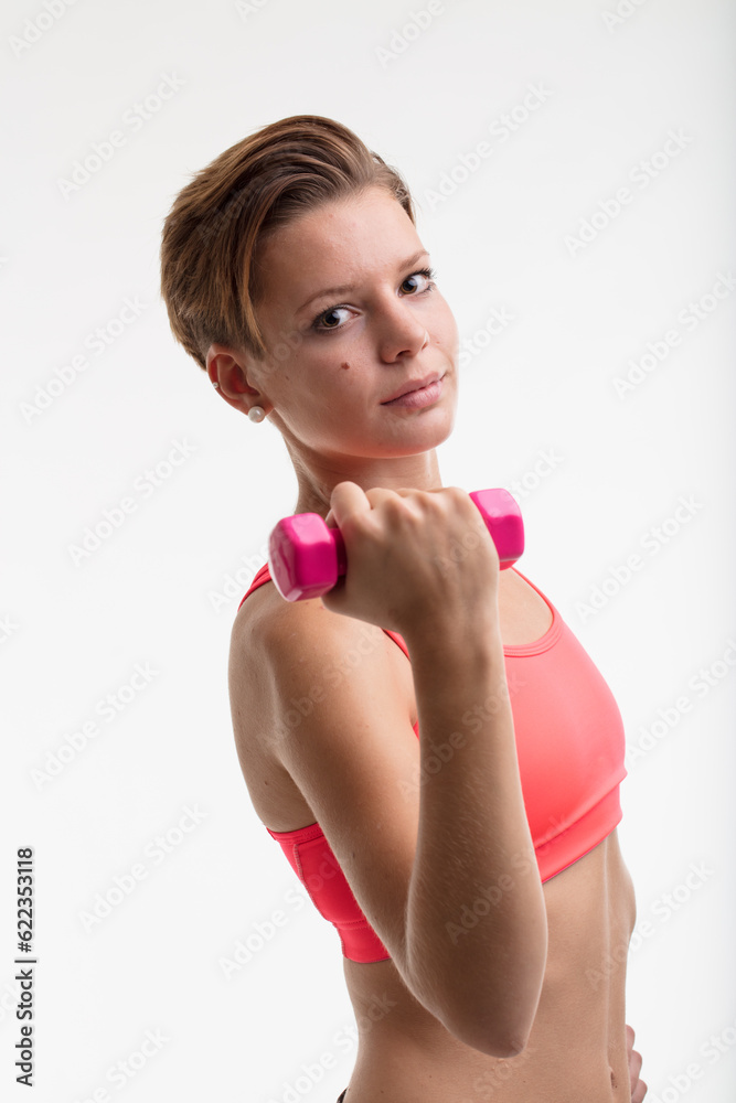 young woman weightlifting to train her body daily after running to complete her fitness workout young woman weightlifting to train her body daily after running to complete her fitness workout