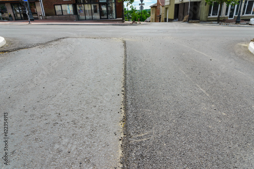 Wallpaper Mural A large layer of fresh asphalt in the town.Layer of asphalt raw material in a shallow depth of field. Road construction. Construction of a new road. Torontodigital.ca