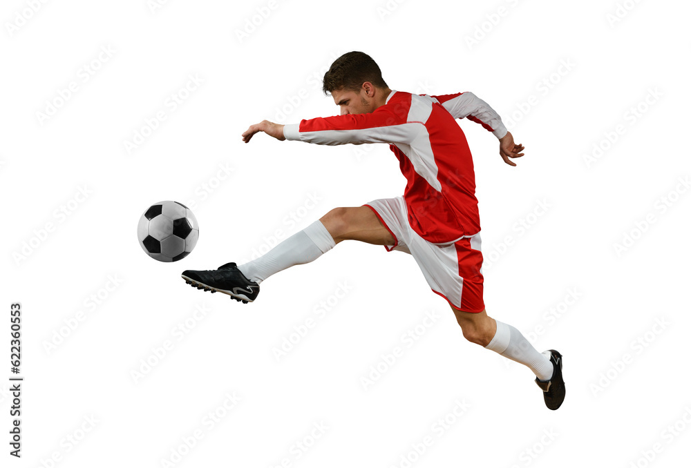 Soccer  player kicks the soccerball in the air by jumping