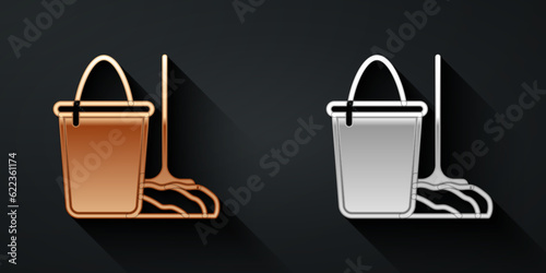 Gold and silver Mop and bucket icon isolated on black background. Cleaning service concept. Long shadow style. Vector