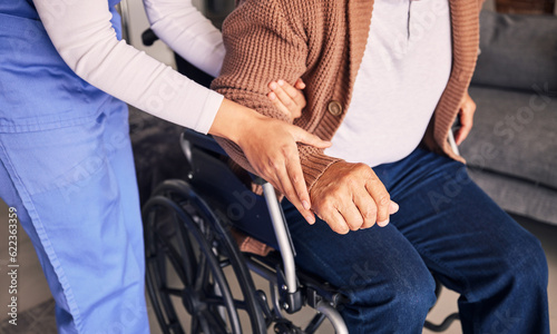 Hands, nurse and patient in wheelchair for support, medical service and physical therapy in retirement home. Closeup of caregiver helping elderly person with disability, healthcare and nursing aid