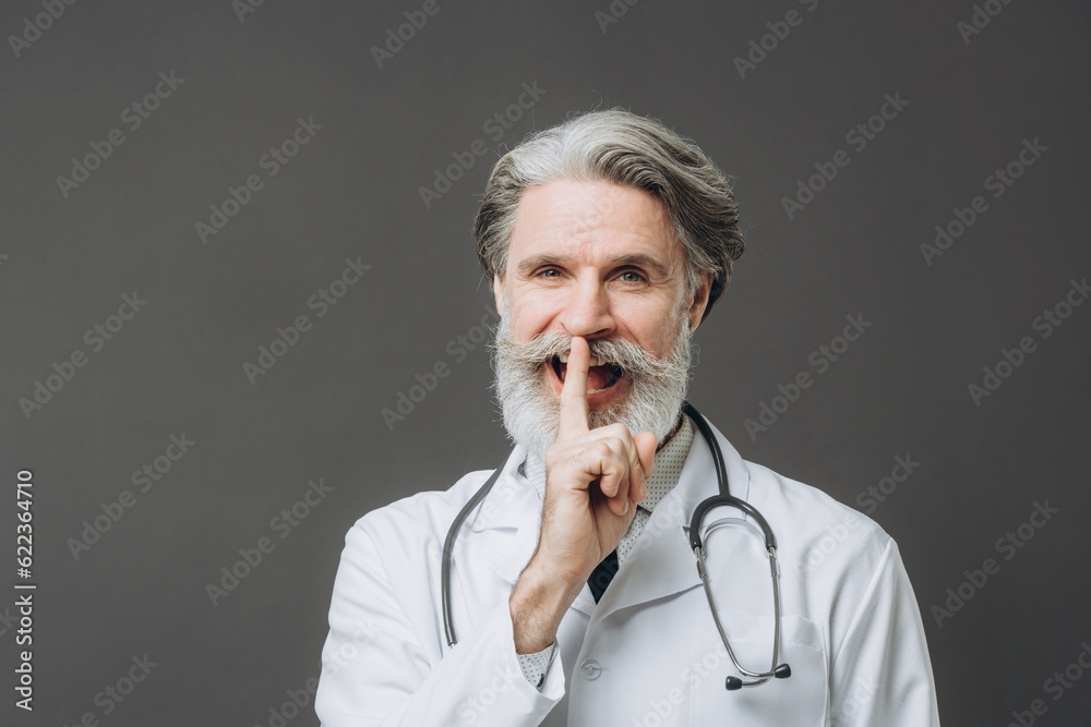 Portrait of smiling mature doctor looking in the camera Portrait of smiling mature doctor looking in the camera