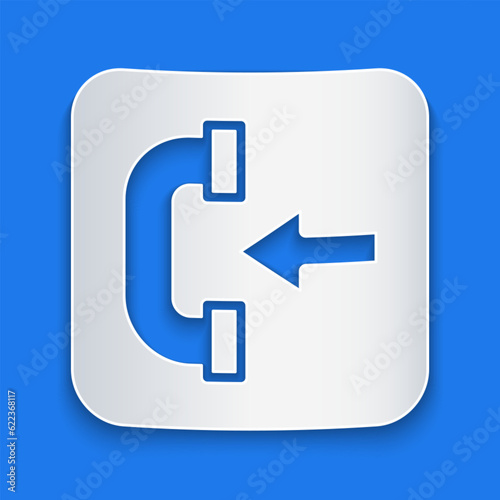 Paper cut Incoming call phone icon isolated on blue background. Phone sign. Telephone handset. Paper art style. Vector