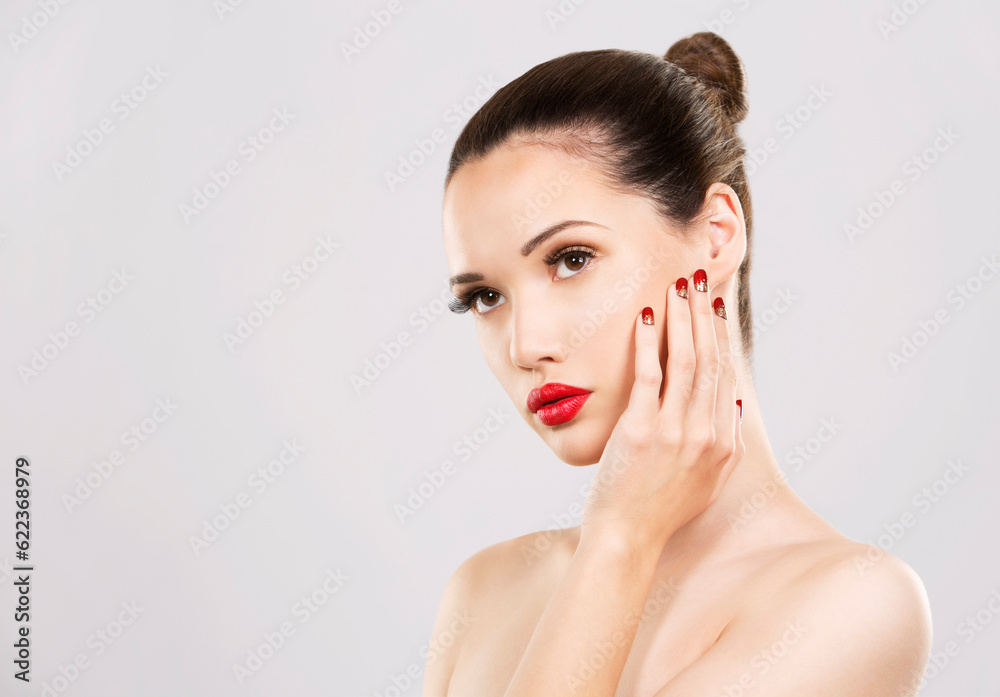 beautiful woman with dark makeup and red lipstick posing on light grey background beautiful woman with dark makeup and red lipstick posing on light grey background