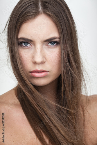 strong facial expression concept - young woman portrait with resentful negative grimace on her face