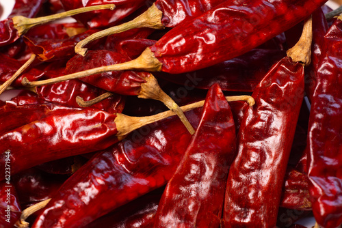 Bright Red dried red chillies are display on white background