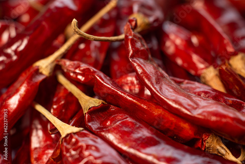 Bright Red dried red chillies are display on white background
