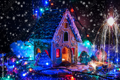 Gingerbread house with lights on dark background  xmas theme