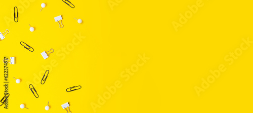 Black and white stationery on yellow background, negative space.Back to school concept.