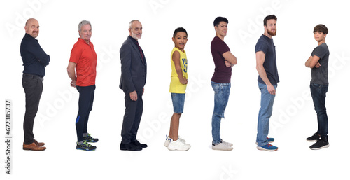 line of a side view of a group of men looking at camera on white background photo