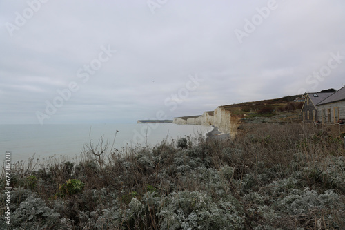 A Winter walk in East Sussex to see the Seven Sisters, Cuckmere Haven and the Long Man of Wilmington. A calming walking weekend on Englands chalk cliff coastline. photo