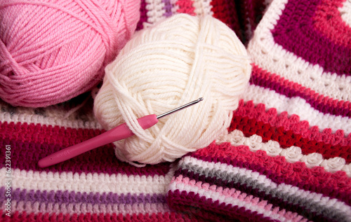 Clews of thread for knitting and a crochet hook