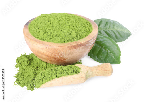 Leaves, bowl and scoop with matcha powder isolated on white