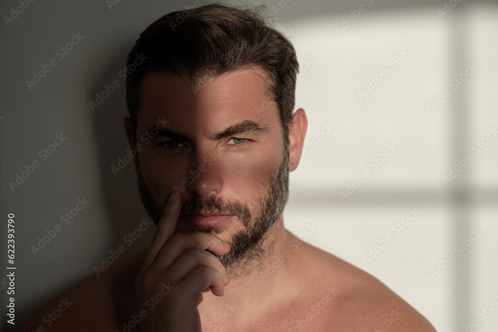 Cosmetics, body care and spa treatment. Portrait of masculinity charming shirtless man isolated over white background. Close-up portrait of attractive guy. Wellness, healthcare and hygiene. Cosmetics, body care and spa treatment. Portrait of masculinity charming shirtless man isolated over white background. Close-up portrait of attractive guy. Wellness, healthcare and hygiene.