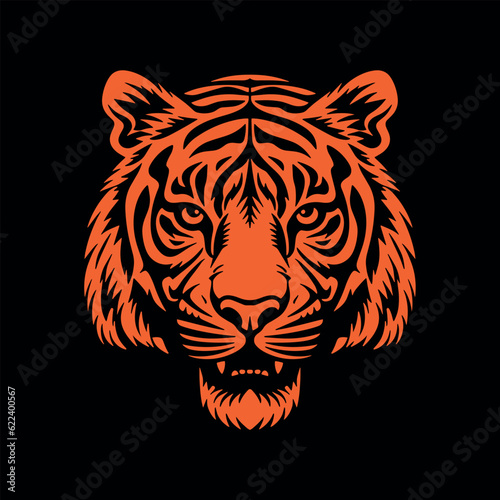 Orange tiger head silhouette, vector illustration on black background