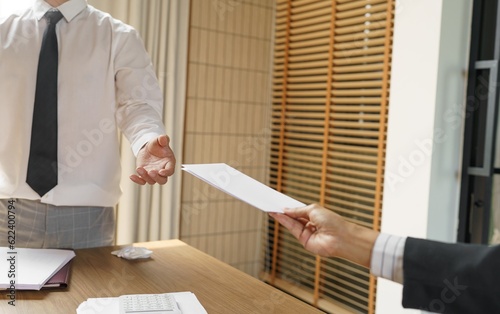 Quit Job Business man sending resignation letter and packing Stuff Resign Depress or carrying business cardboard box in office. Change of job or fired from company.