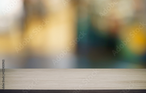 Murais de parede Empty wood table top and blur of out door garden background Empty wooden table space for text marketing promotion