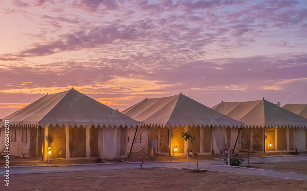 Luxury tents for Tourist with Dramatic sky during sunrise Luxury tents for Tourist with Dramatic sky during sunrise