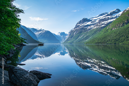Lake Lovatnet in the mountains of Norway. Reflections in the glacier water. 