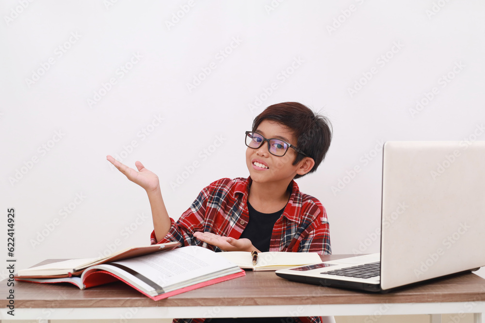 Happy asian student presenting something on empty space white studying on the desk. Isolated Happy asian student presenting something on empty space white studying on the desk. Isolated
