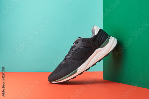 Men's fashion sport footwear. Product photo of sneaker on a colorful background. Interior poster. Street trainers.