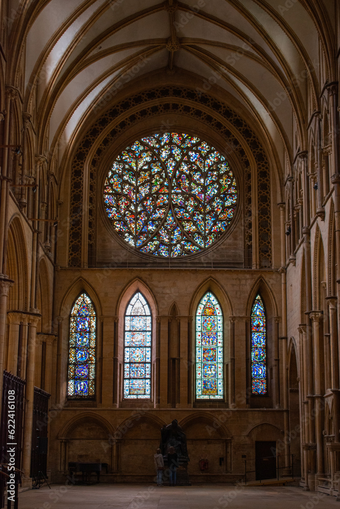 decorated stain glass windows corridor archway	