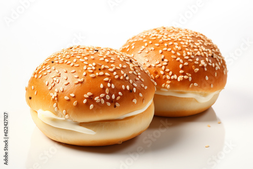 two buns with sesame seeds on white background photo