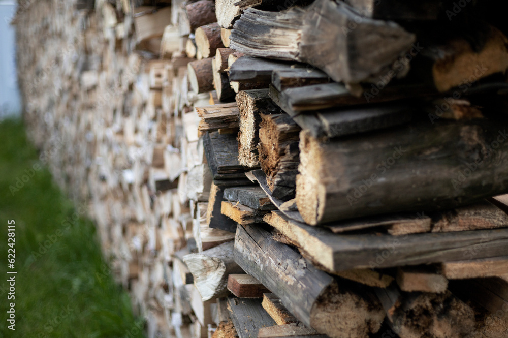 chopped firewood in a woodpile in the country
