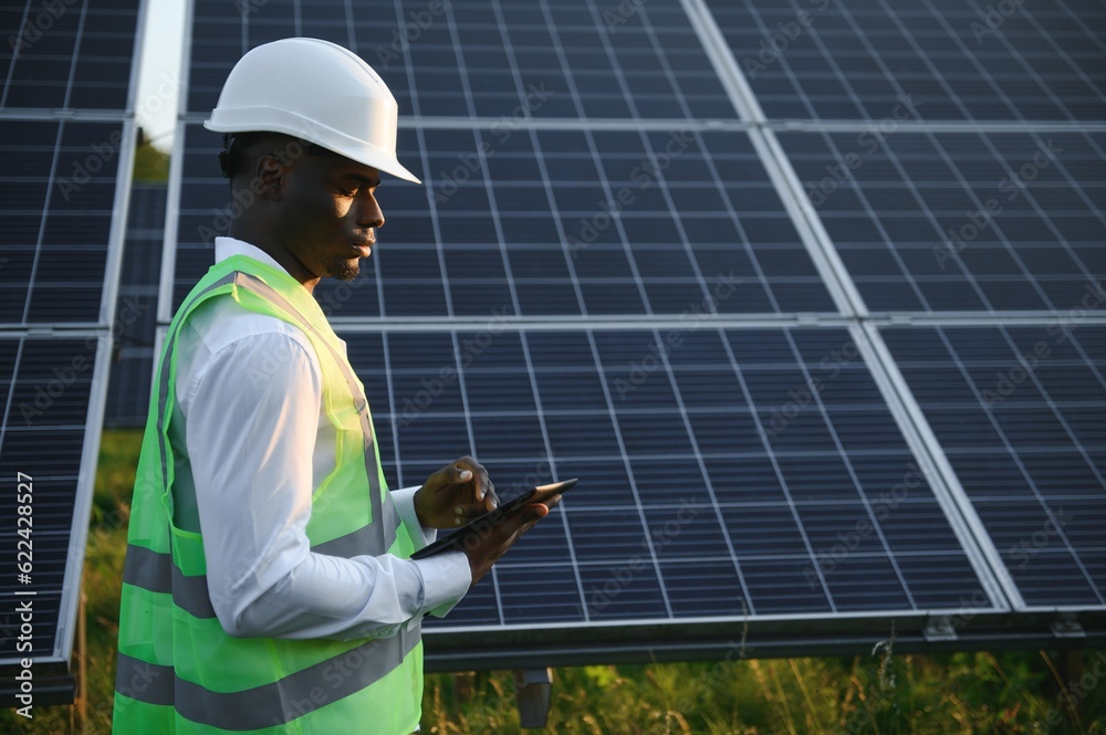 Photovoltaic Green Energy Technology. Worker At Solar Panel Plant Photovoltaic Green Energy Technology. Worker At Solar Panel Plant