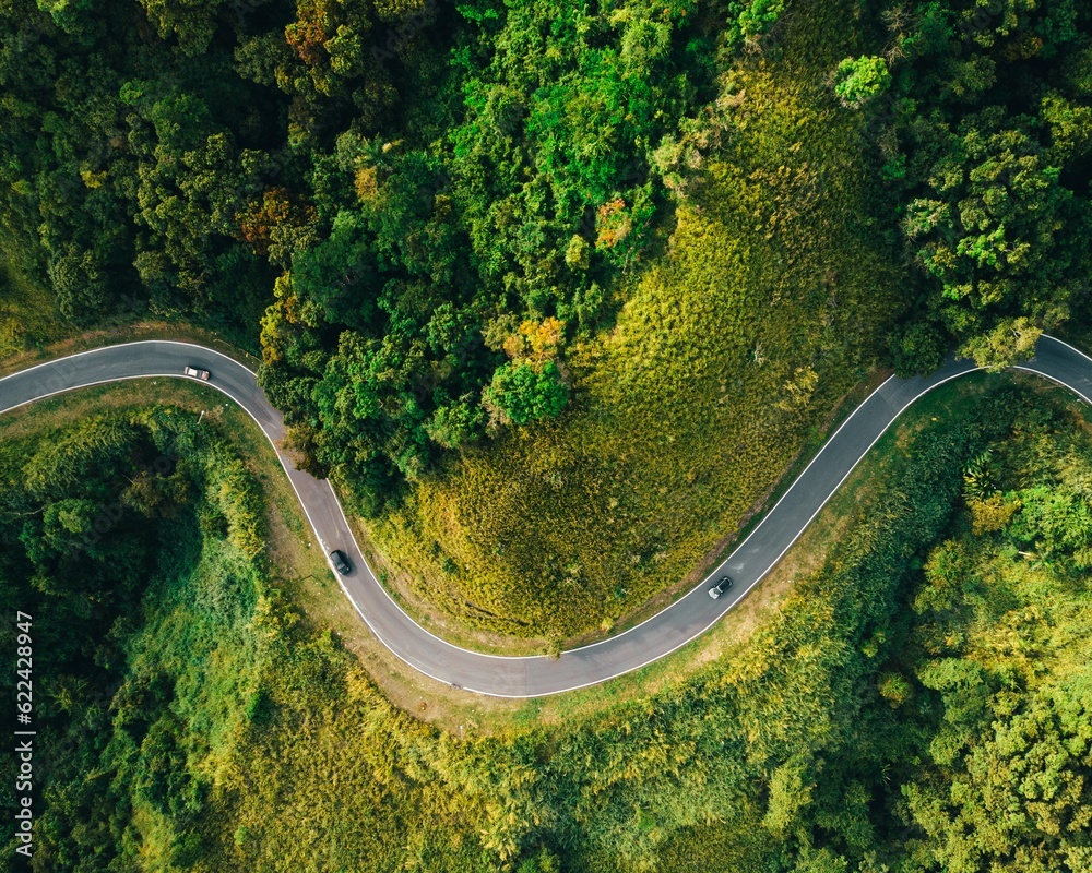 Beautiful green mountain road curve landscape of a drone capture topdown from puerto rico