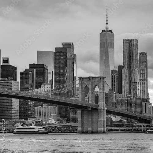 city bridge and city skyline © Adrian de la Paz