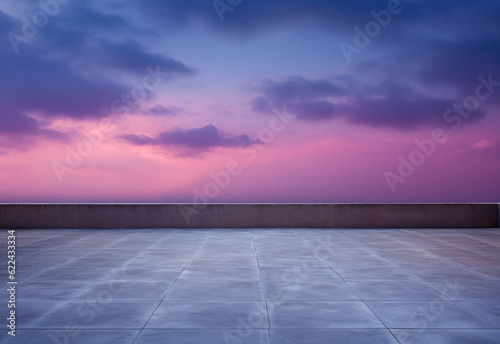 A view of the purple sky at dusk over the rooftop of a building. 