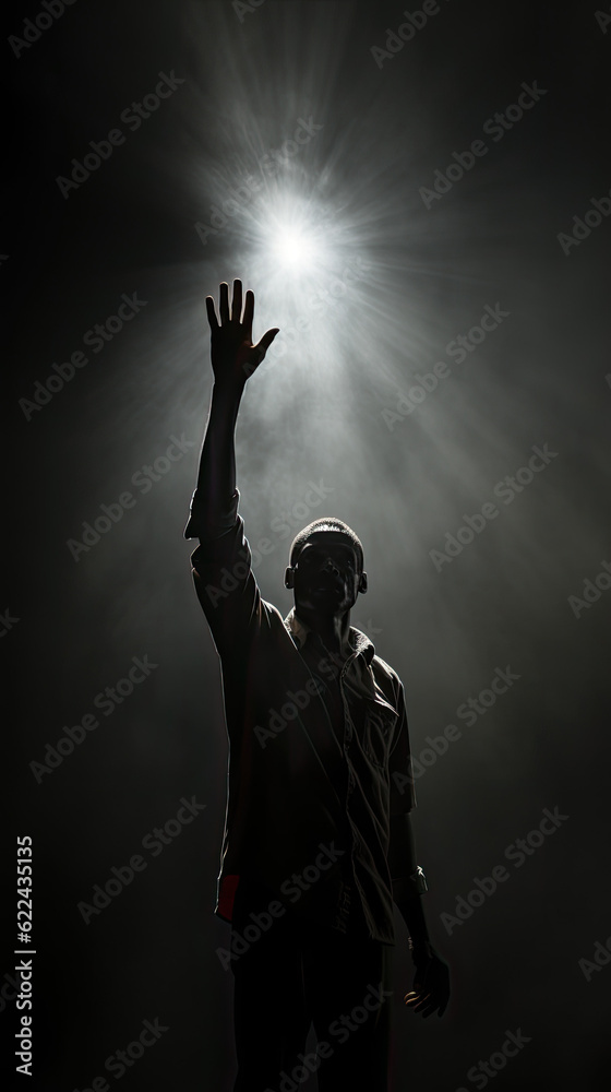 A silhouette of a person reaching out their hand in a stop gesture, conveying a sense of warning and concern