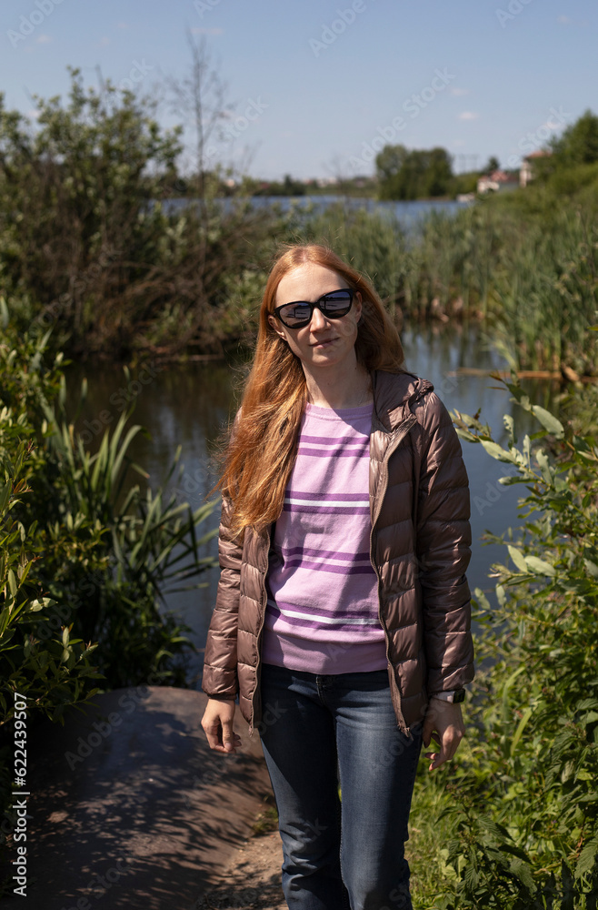 portrait of a girl with long red hair outdoors in summer portrait of a girl with long red hair outdoors in summer