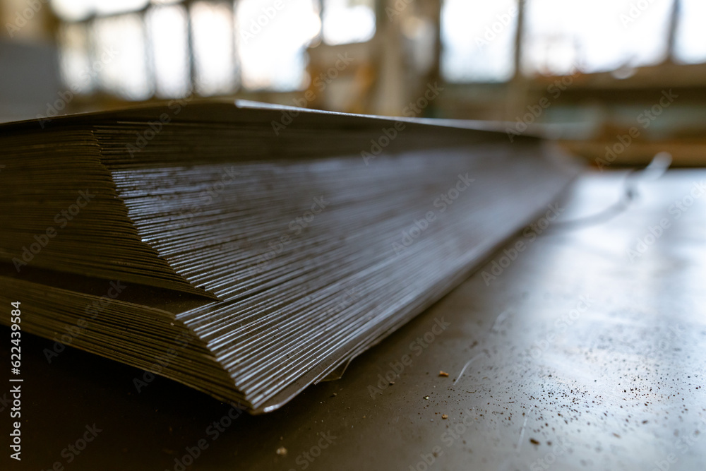 a stack of galvanized thin hot rolled steel sheets in a warehouse a stack of galvanized thin hot rolled steel sheets in a warehouse