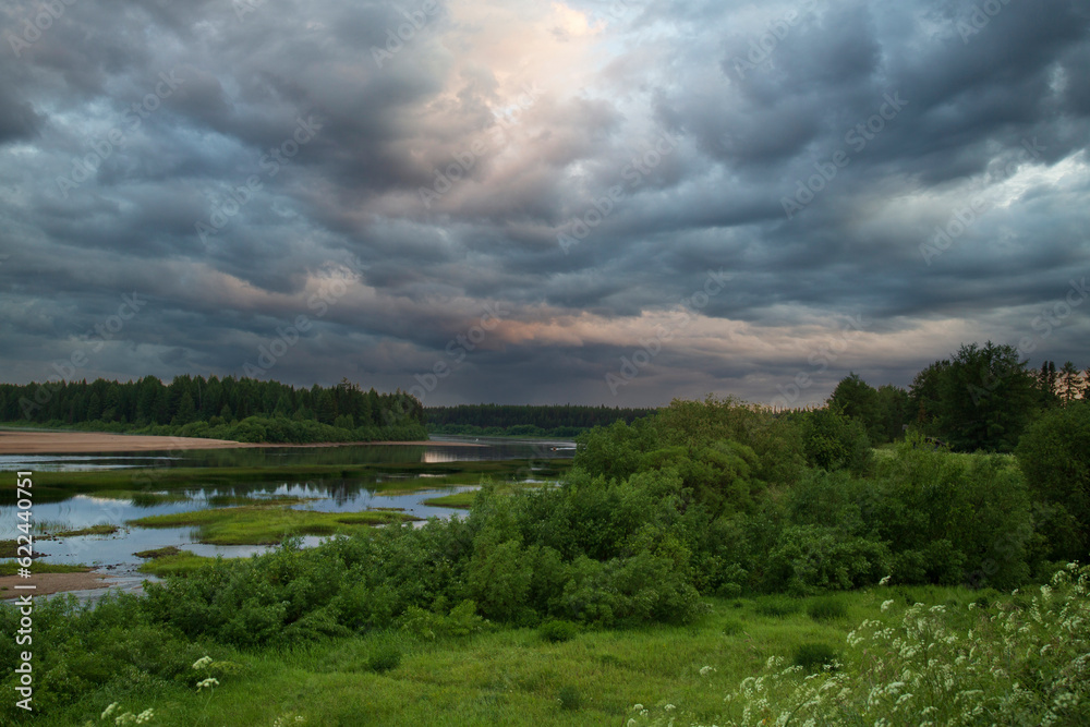 Summer landscape with thunderclouds.Background of the summer sky with thunderclouds.