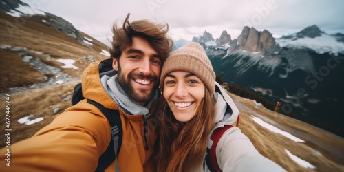 Selfie photo of happy smiling cute couple hikers during traveling together at beautiful destination in the mountains © Adriana