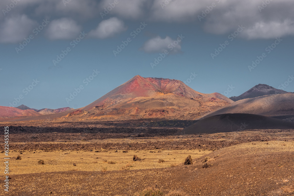 Wild volcanic landscape of Los Volcanes Natural Park in Lanzarote,  Canary Islands, Spain
