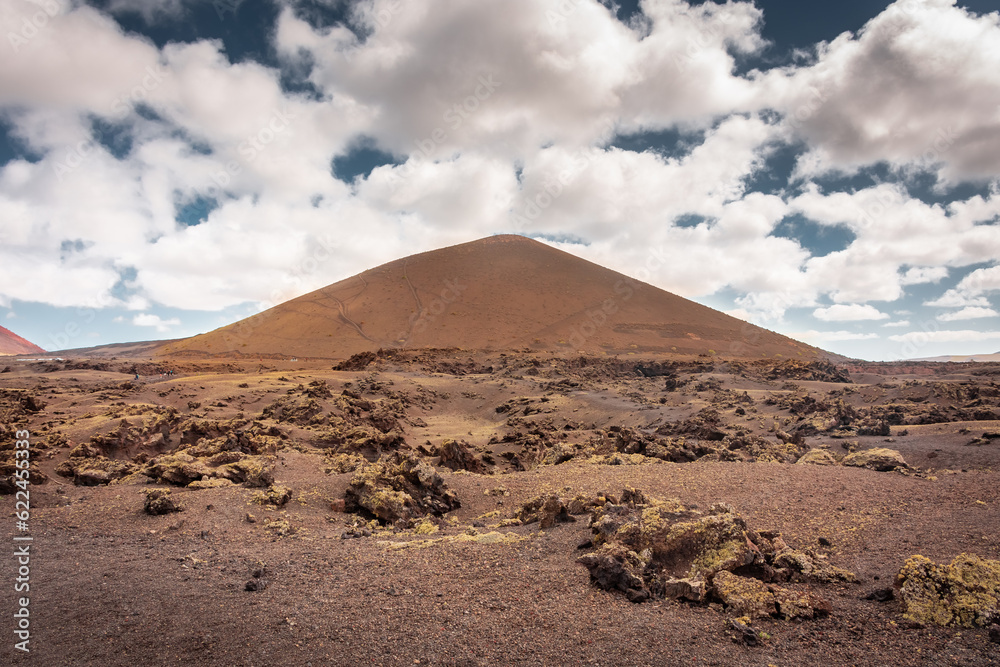 Wild volcanic landscape of Los Volcanes Natural Park in Lanzarote,  Canary Islands, Spain